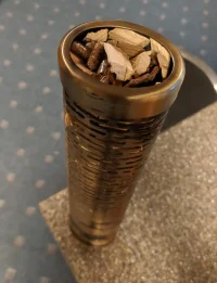 smoke tube with wood chips.webp