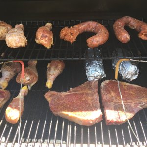 1 of 2   T-Bone Steaks, Chicken Legs, Chicken Sausage, & Baked Potatoes.JPG