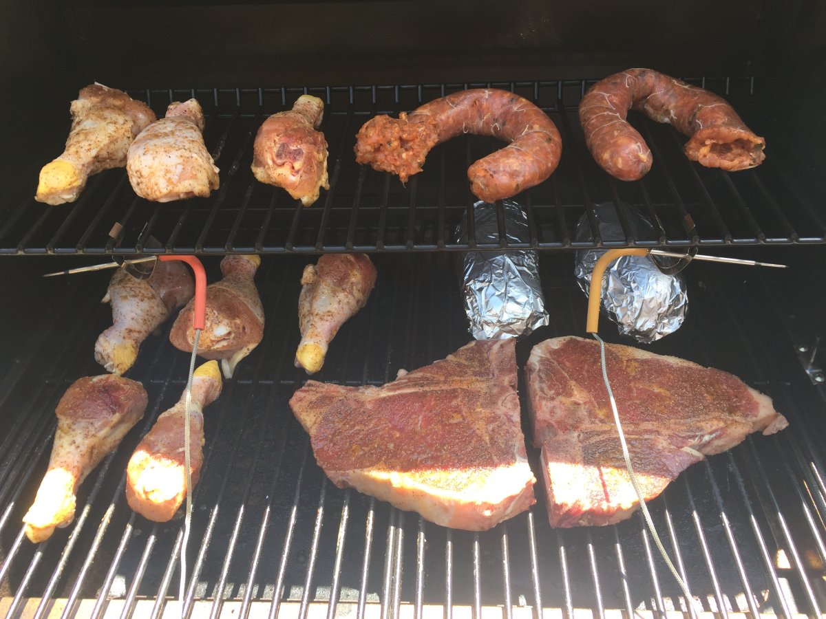 1 of 2   T-Bone Steaks, Chicken Legs, Chicken Sausage, & Baked Potatoes.JPG